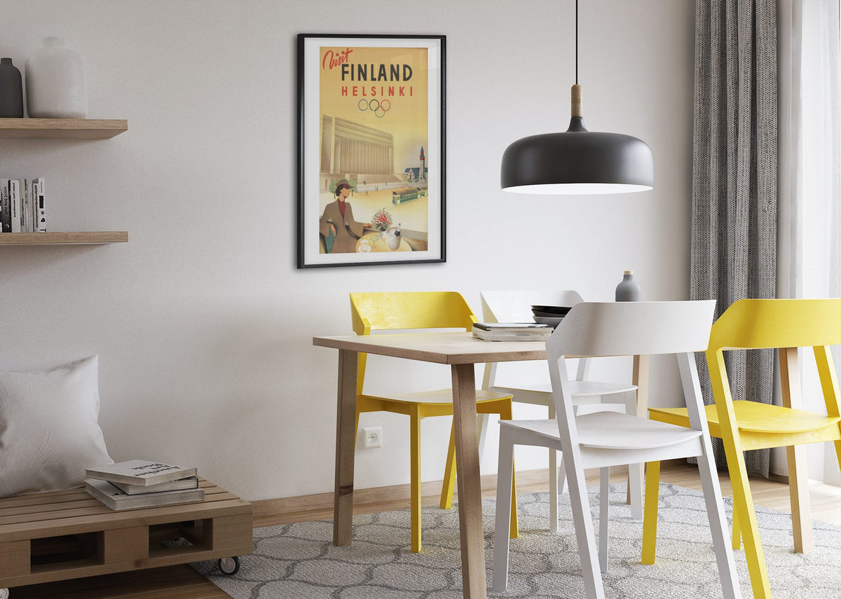 Visit Finland Helsinki poster framed above a dining table