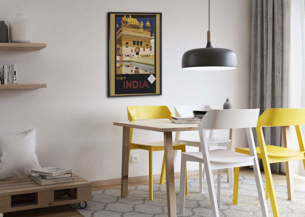 Visit India Golden Temple poster framed above a dining table