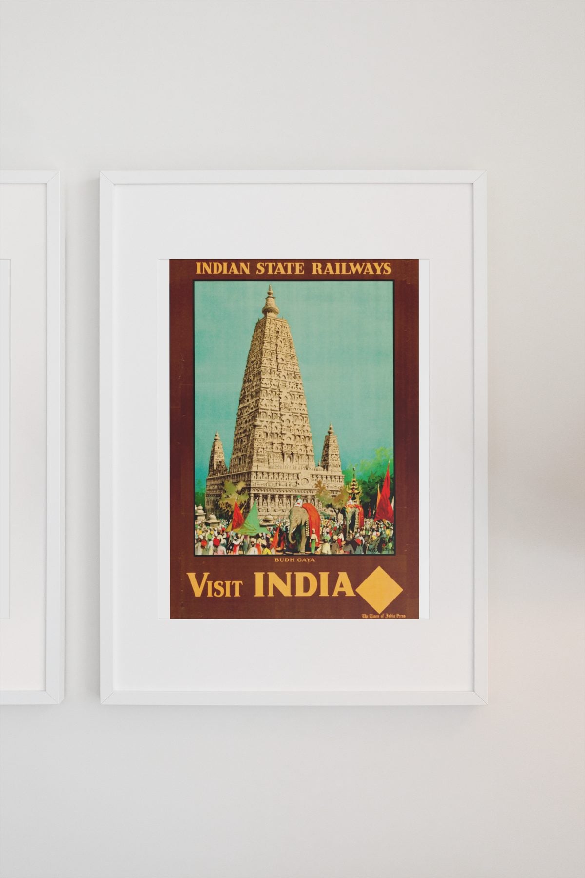 Visit India Indian State Railways poster on a light wall