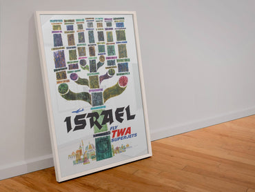 Visit Israel Fly TWA poster in a white frame leaning against a wall