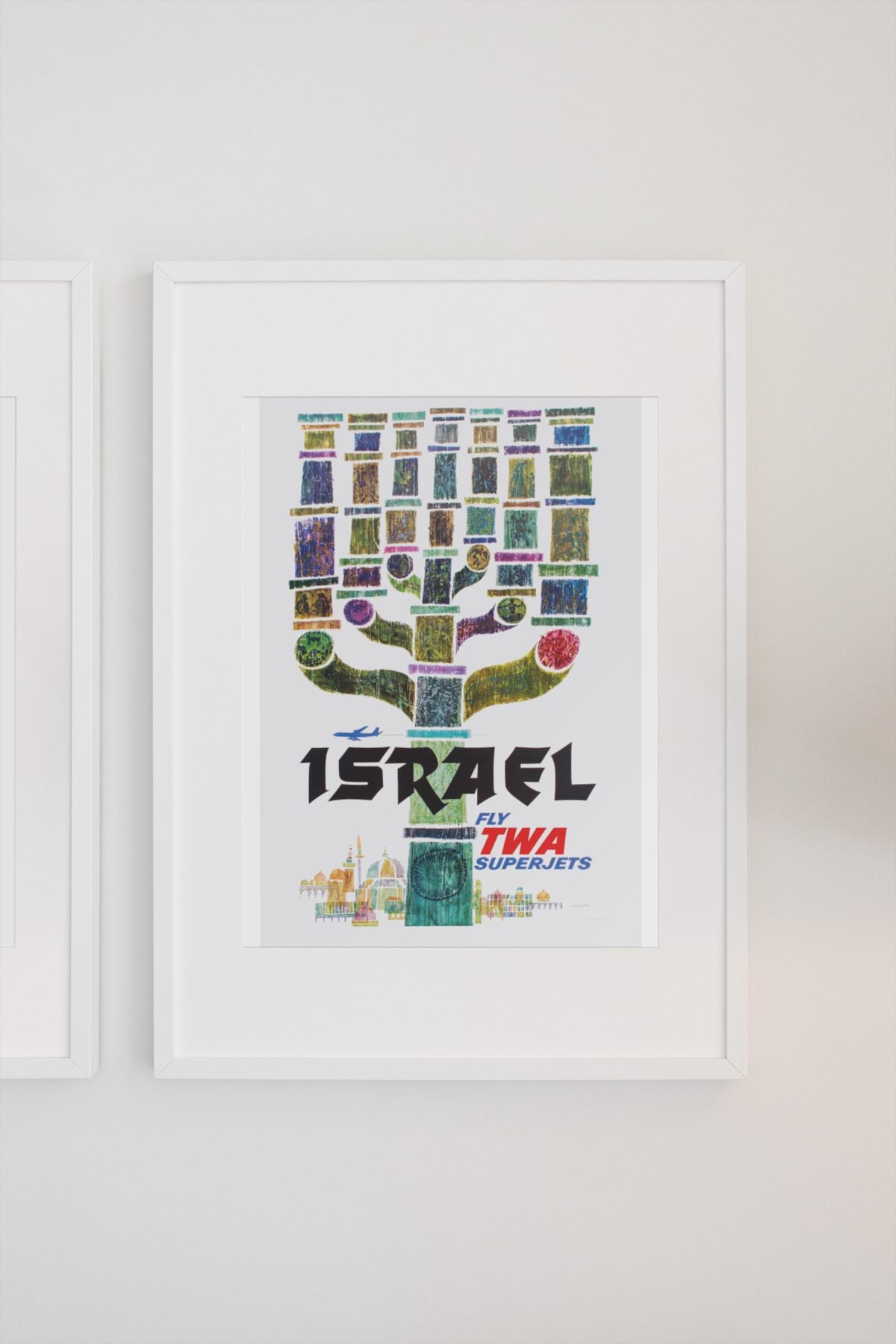 Visit Israel Fly TWA poster on a light wall
