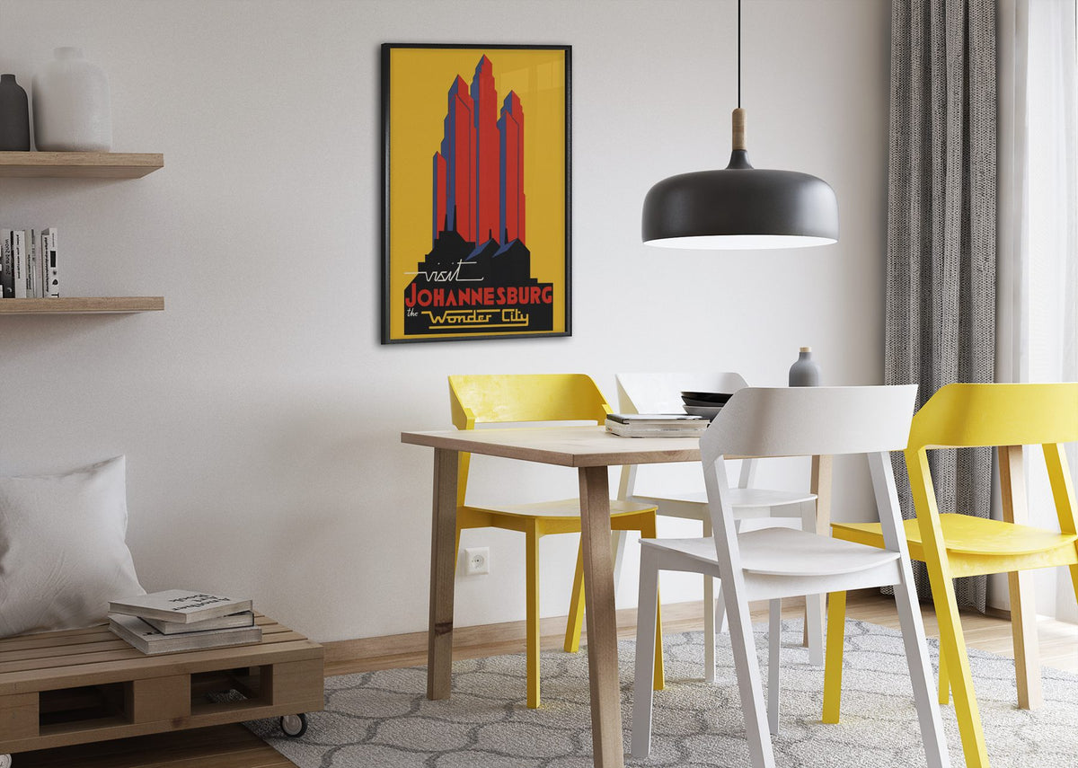 Visit Johannesburg poster framed above a dining table