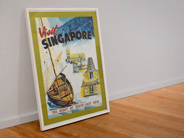 Visit Singapore poster in a white frame leaning against a wall