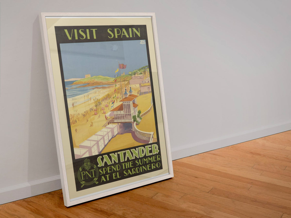 Visit Spain Santander poster in a white frame leaning against a wall