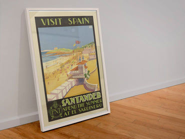Visit Spain Santander poster in a white frame leaning against a wall