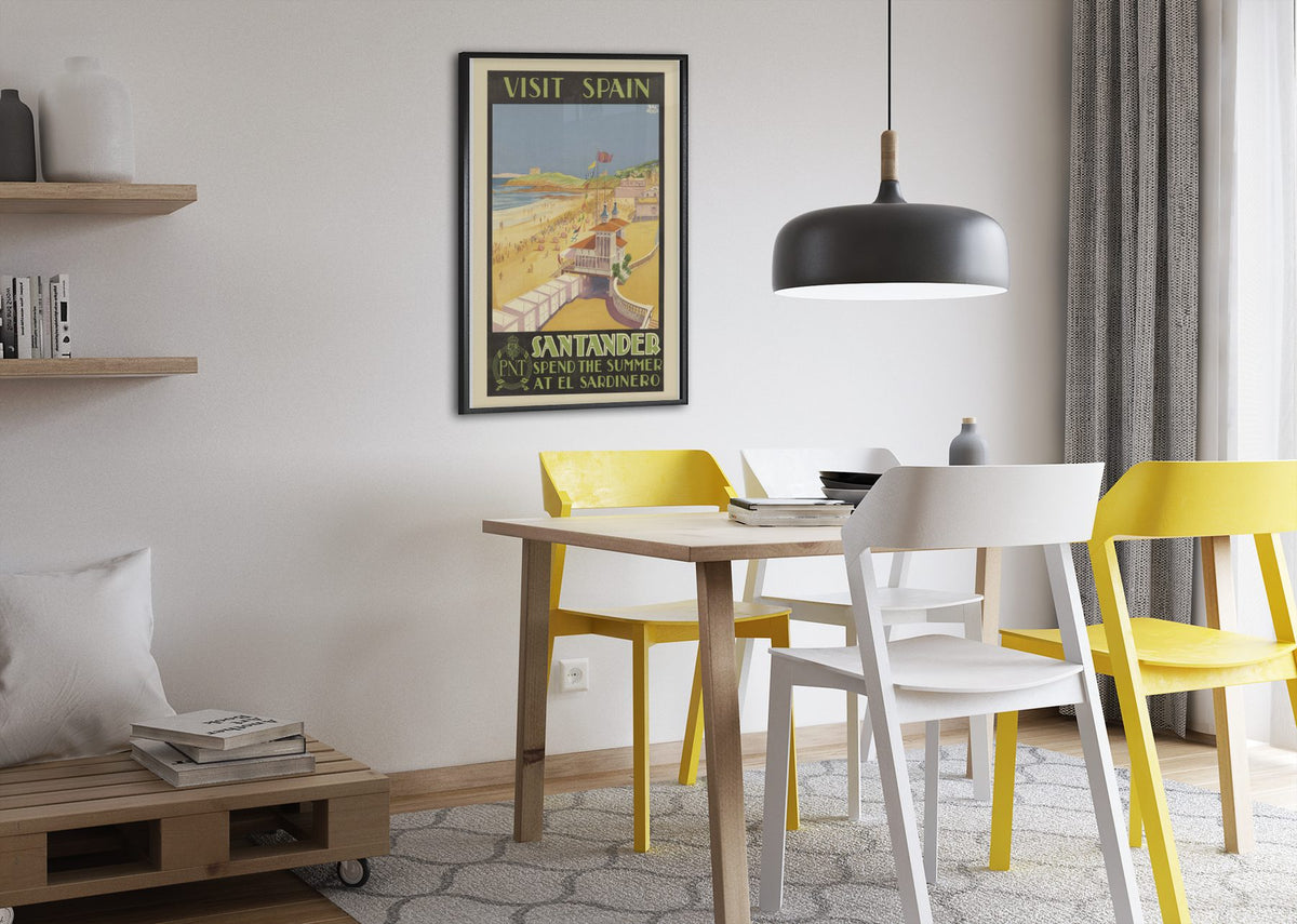 Visit Spain Santander poster framed above a dining table