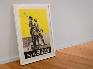 Visit the Sudan poster in a white frame leaning against a wall