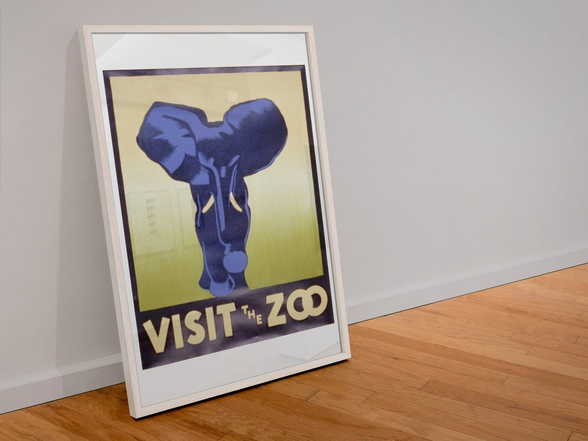 Visit the Zoo Elephant poster in a white frame leaning against a wall