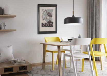 Visit the Zoo Herons poster framed above a dining table