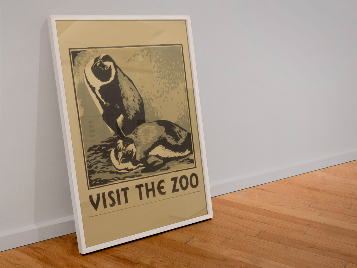Visit the Zoo Penguin poster in a white frame leaning against a wall
