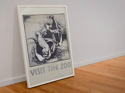 Visit the Zoo Penguins poster in a white frame leaning against a wall