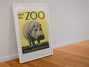 Visit the Zoo Philadelphia Hippo poster in a white frame leaning against a wall