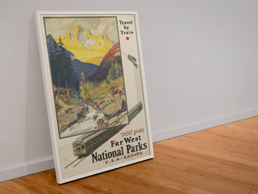 Far West National Parks Travel by Train poster in a white frame leaning against a wall