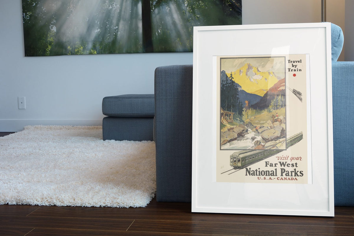 Far West National Parks Travel by Train poster leaning beside a blue sofa