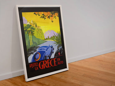 Visitez la Grece en Auto poster in a white frame leaning against a wall