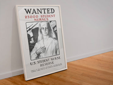 Wanted 25000 Student Nurses poster in a white frame leaning against a wall