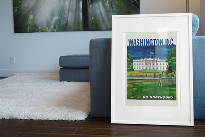 Washington DC Go Greyhound poster leaning beside a blue sofa