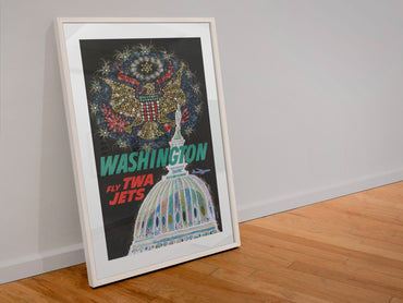 Washington Fly TWA Jets poster in a white frame leaning against a wall