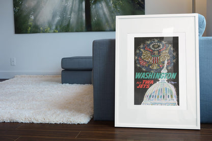 Washington Fly TWA Jets poster leaning beside a blue sofa