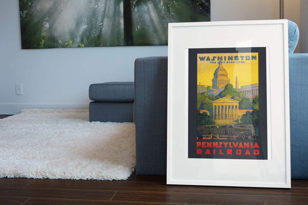 Washington Pennsylvania Railroad poster leaning beside a blue sofa
