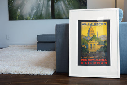Washington Pennsylvania Railroad poster leaning beside a blue sofa
