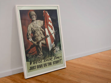 Well Lick Em Just Give Us the Stuff poster in a white frame leaning against a wall