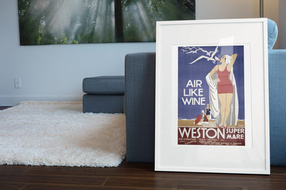 Weston super Mare Air Like Wine poster leaning beside a blue sofa