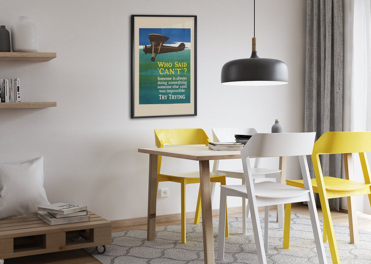 Who Said “Can’t” poster framed above a dining table