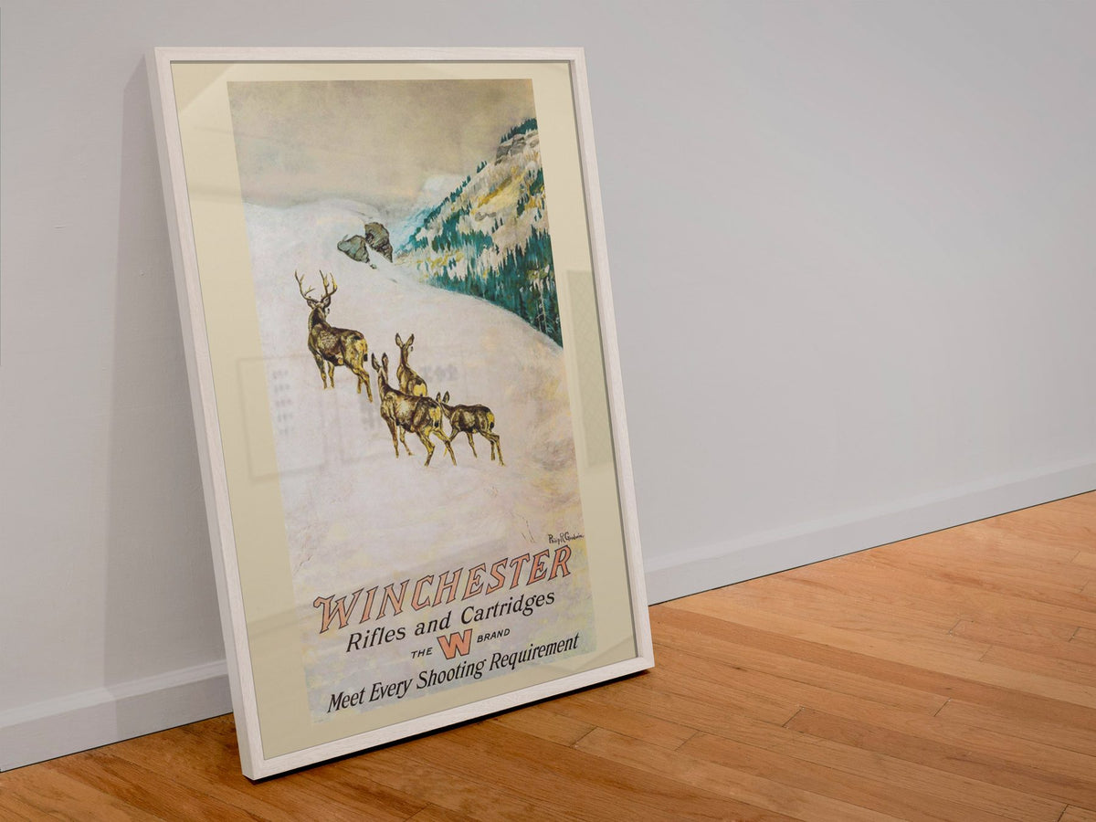 Winchester Rifles and Cartridges — Deer poster in a white frame leaning against a wall