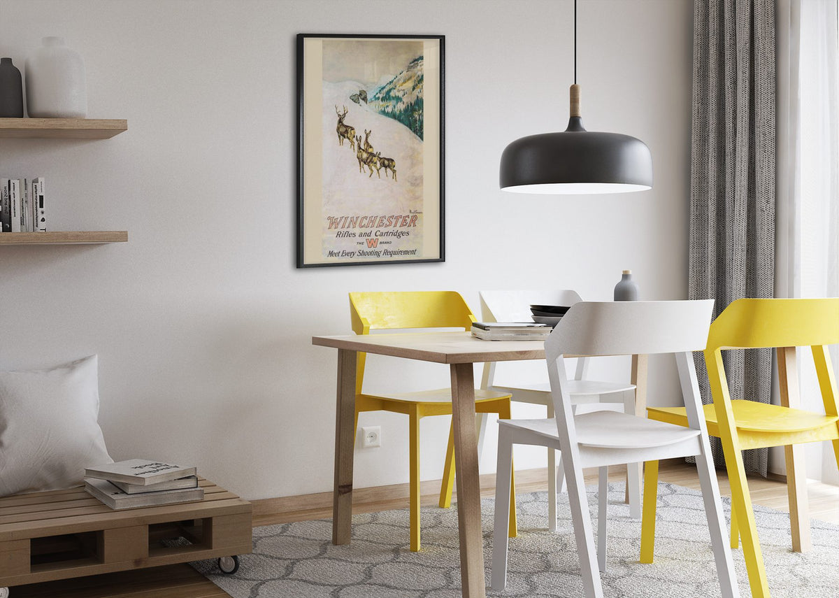 Winchester Rifles and Cartridges — Deer poster framed above a dining table
