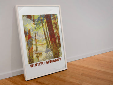 Winter in Germany poster in a white frame leaning against a wall