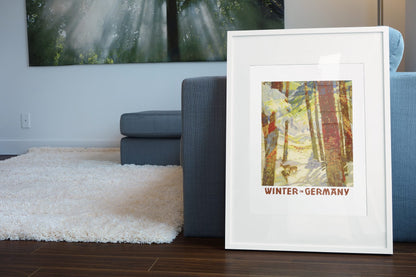 Winter in Germany poster leaning beside a blue sofa