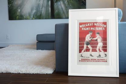 Wolgast Nelson Fight Pictures poster leaning beside a blue sofa