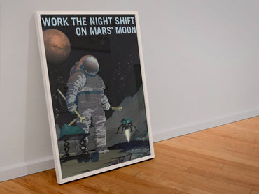 Work the Night Shift on Mars' Moon poster in a white frame leaning against a wall