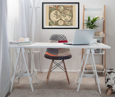 World Map 1689 framed above a white desk in a home office