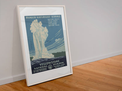 Yellowstone Old Faithful WPA poster in a white frame leaning against a wall
