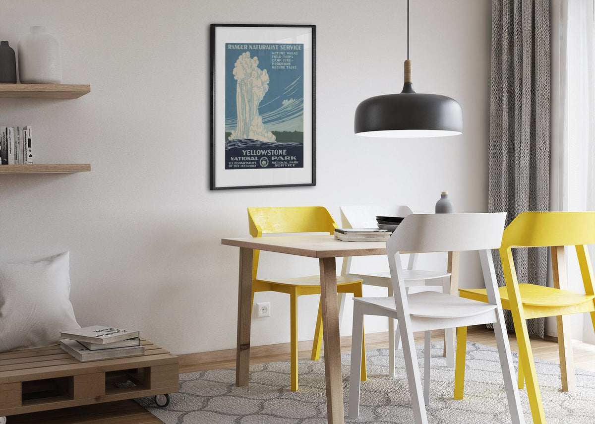 Yellowstone Old Faithful WPA poster framed above a dining table