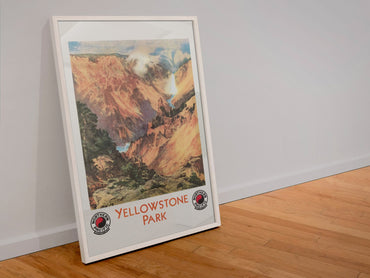 Yellowstone Park 1924 poster in a white frame leaning against a wall
