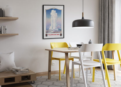Yellowstone Old Faithful poster framed above a dining table