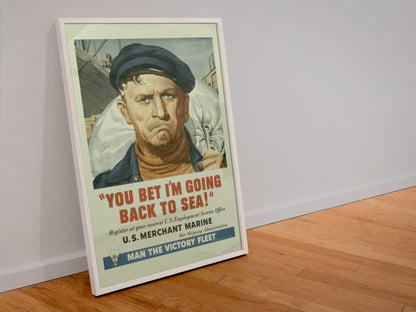 You Bet Im Going Back to Sea Merchant Marine poster in a white frame leaning against a wall