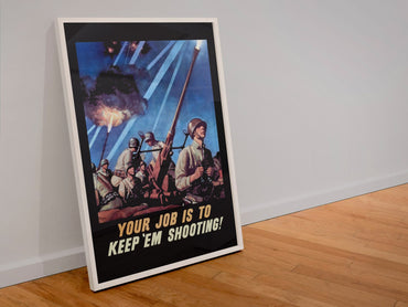 Your Job Is to Keep Em Shooting poster in a white frame leaning against a wall