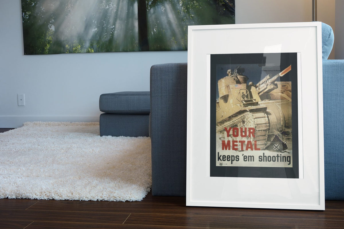 Your Metal Keeps Em Shooting poster leaning beside a blue sofa