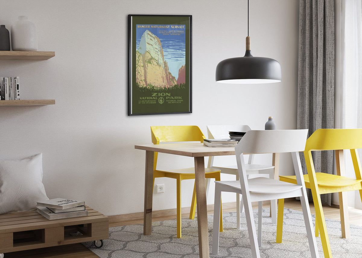 Zion National Park poster framed above a dining table